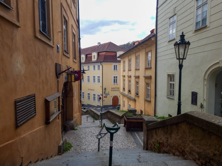 A narrow street with steps leading up to a building