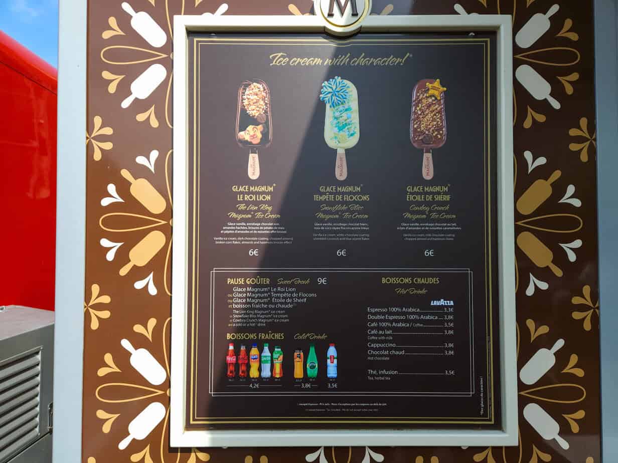 Close-up of a themed ice cream menu at Disneyland Paris featuring Lion King, Frozen, and Sheriff Woody-inspired Magnum bars—perfect examples of unique Disneyland Paris snacks.